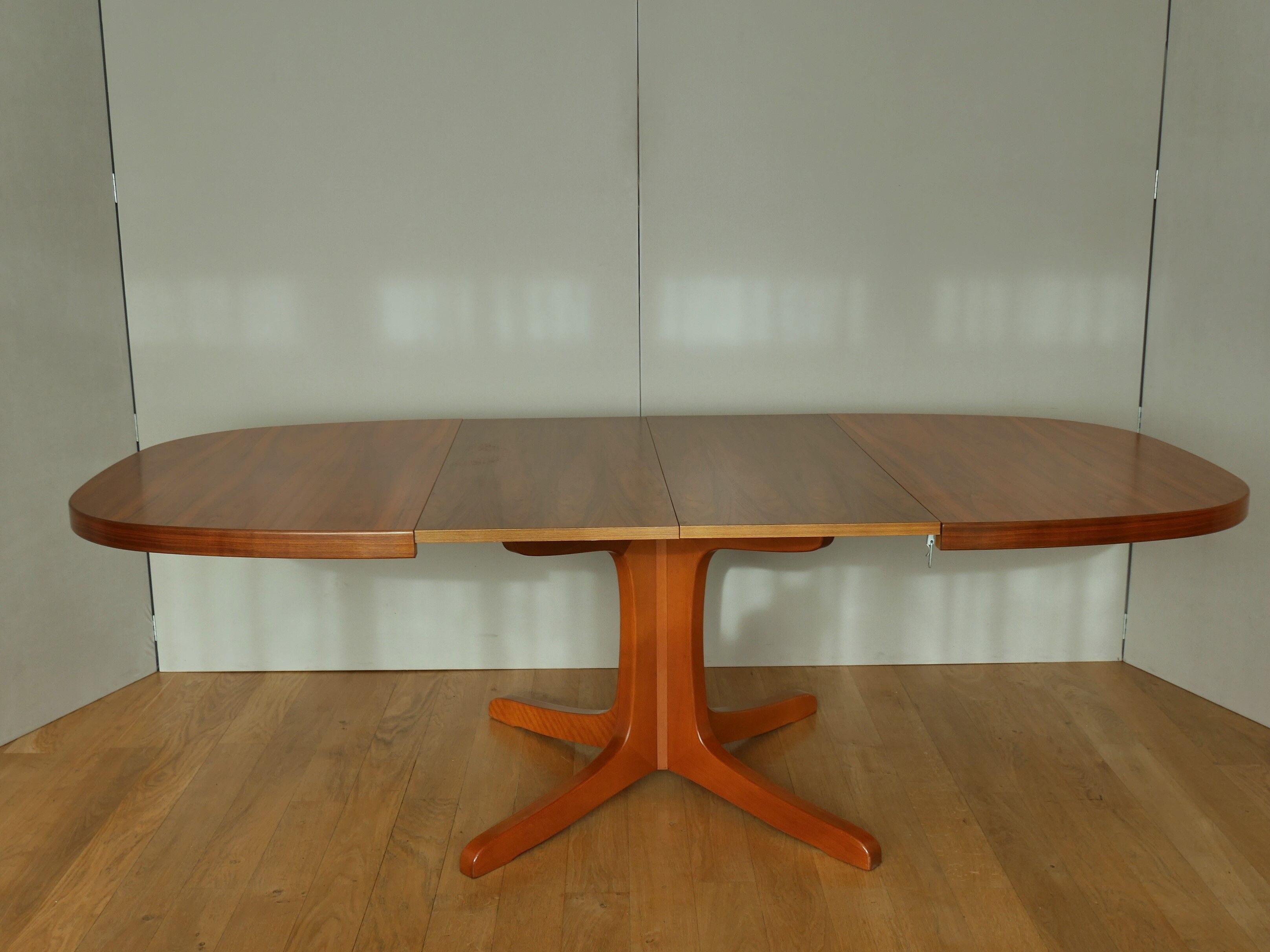 Oval walnut table with extension cords