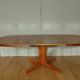 Oval walnut table with extension cords