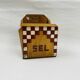 Old wooden salt box with red and white checkerboard decoration