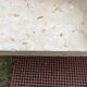 Asymmetrical coffee table from the 80s made of Mactan stone and Magnussen Ponte travertine.