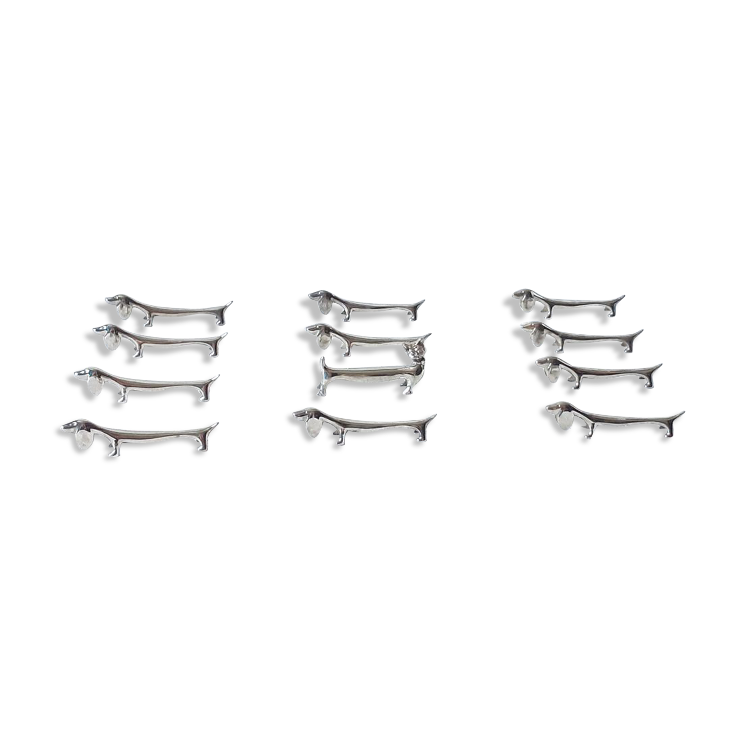 Silver metal dogs, 12 knife holders excellent condition