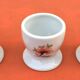 Ulysse Paris porcelain egg cup for Chanill with floral decoration.