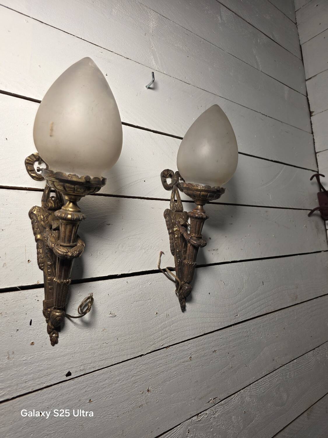 Pair of torch wall lights in Louis XVI style in 19th-century bronze.