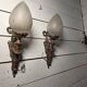 Pair of torch wall lights in Louis XVI style in 19th-century bronze.