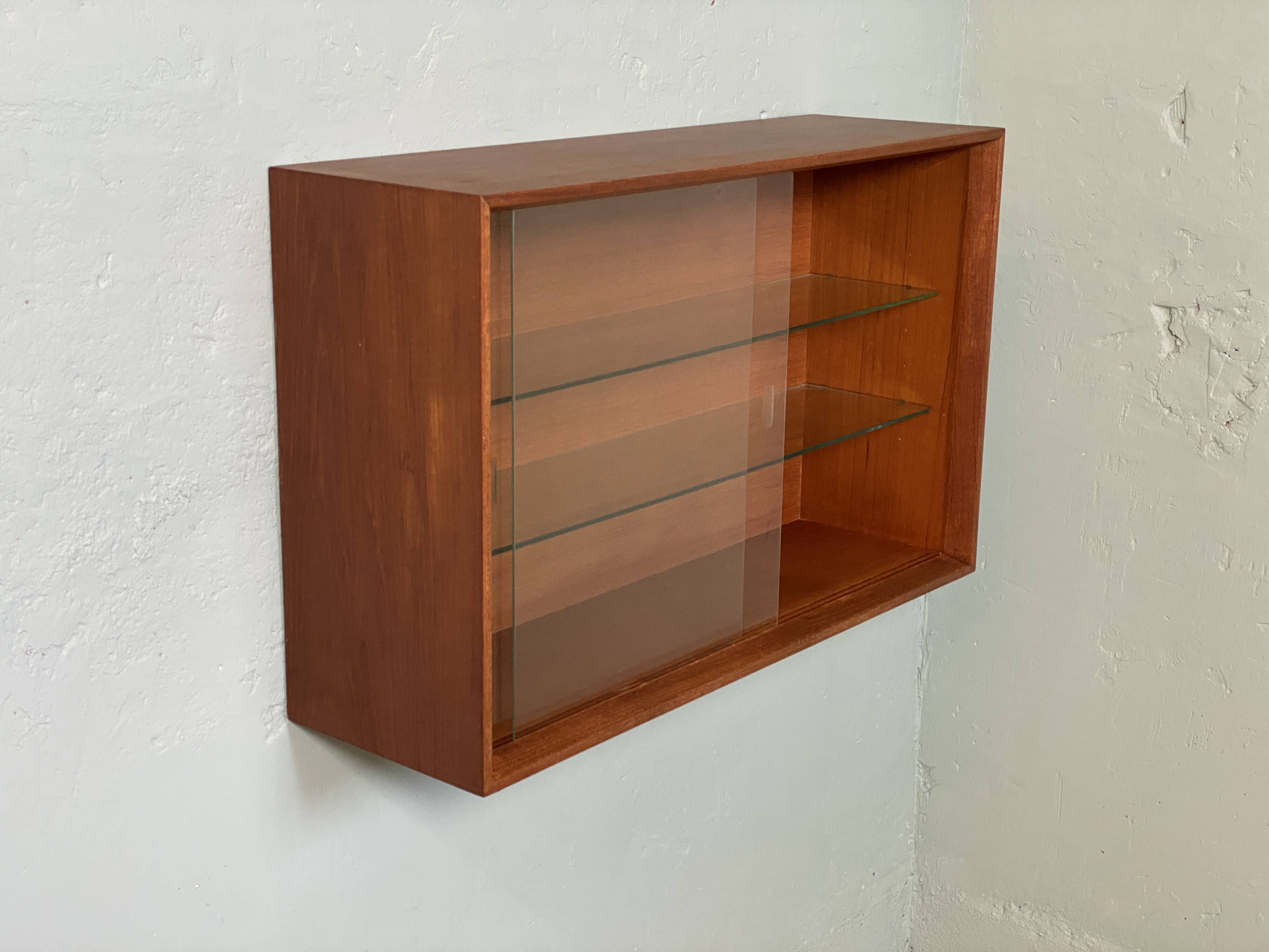 Scandinavian teak wall display cabinet from the 60s