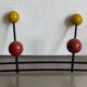 Iron wall coat rack and wooden hooks from the 60s