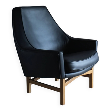 Fauteuil en cuir et chêne IB Kofod-Larsen | OPE Suède | Années 1960