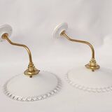 Swan neck sconces in serrated opaline