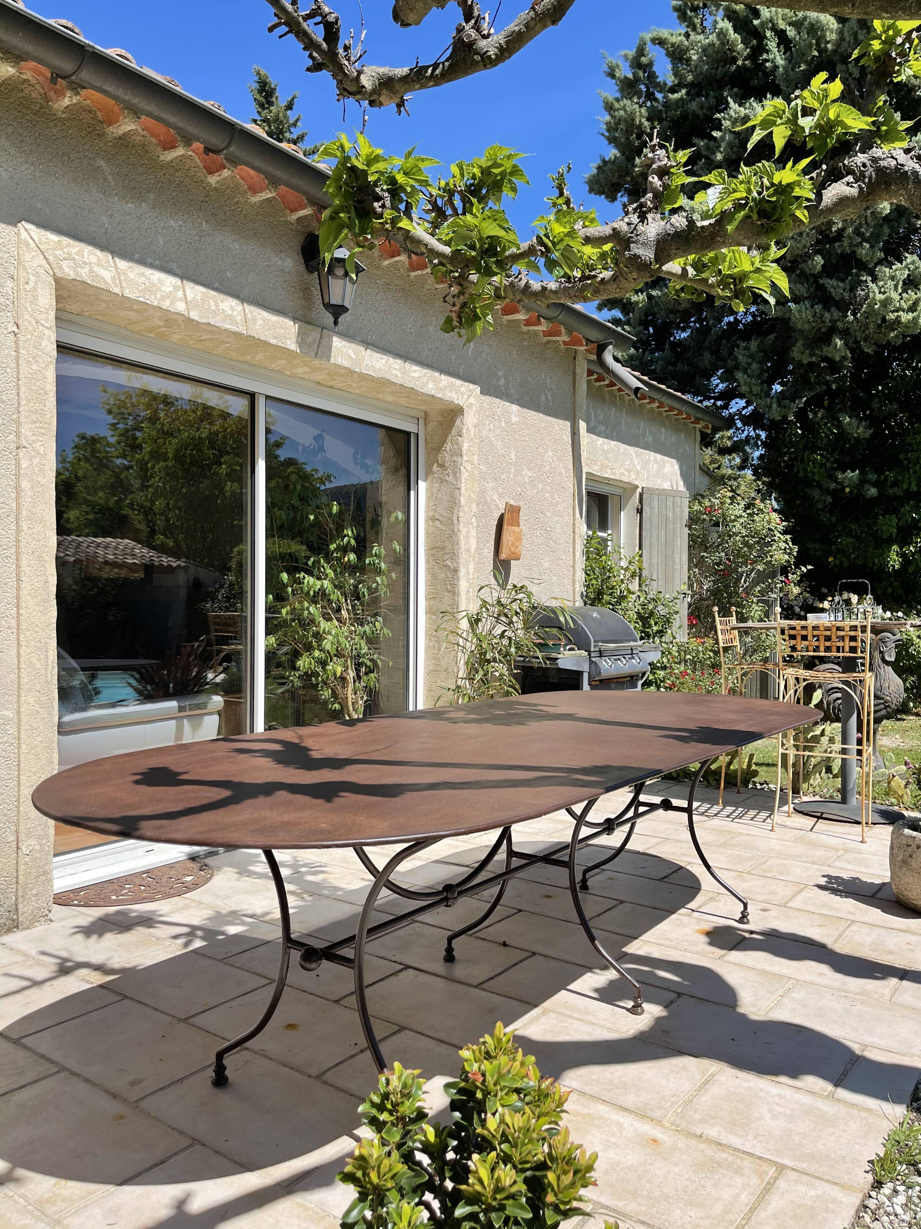 Artisanal wrought iron garden table