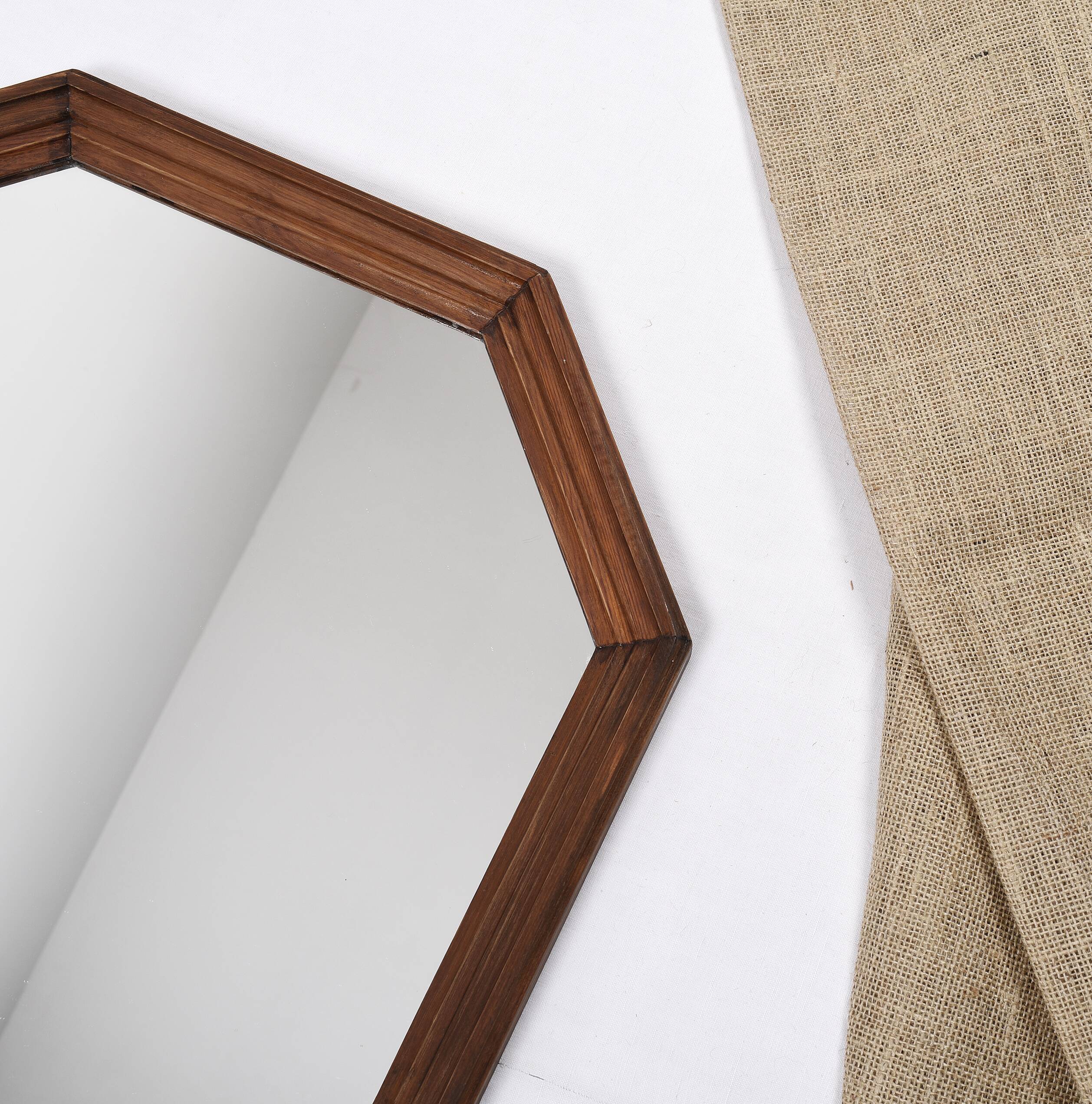 Old second-hand wooden mirror, octagonal shape.