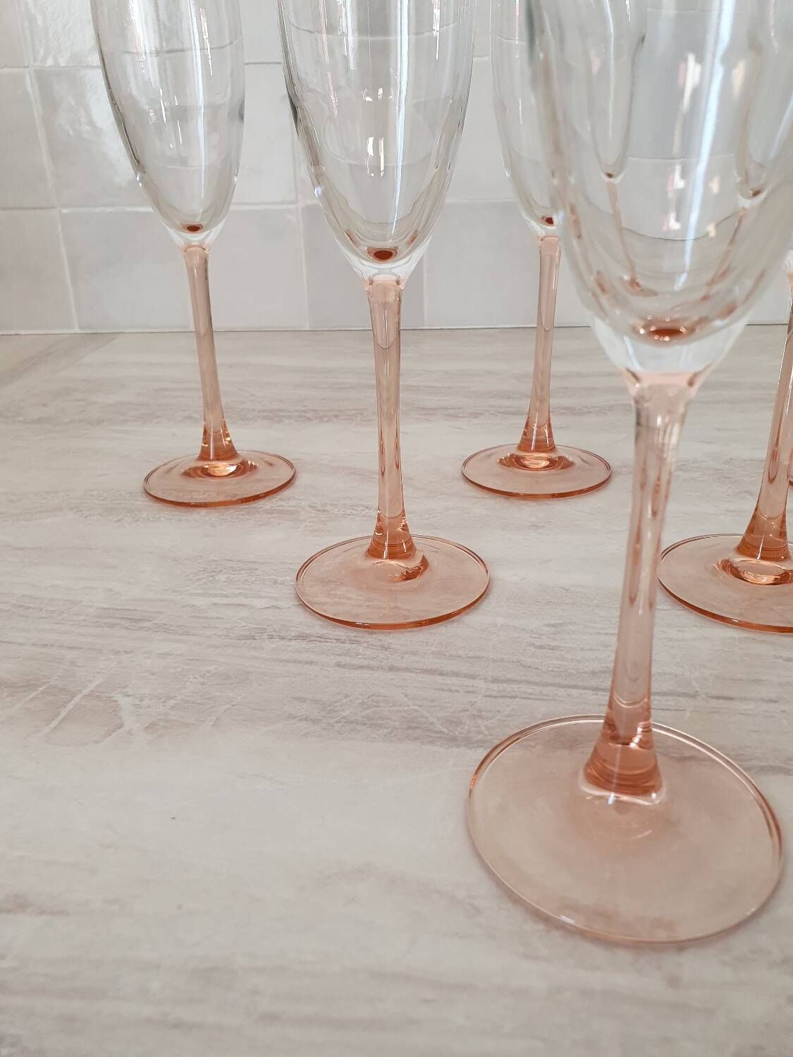 6 champagne flutes with pink stems