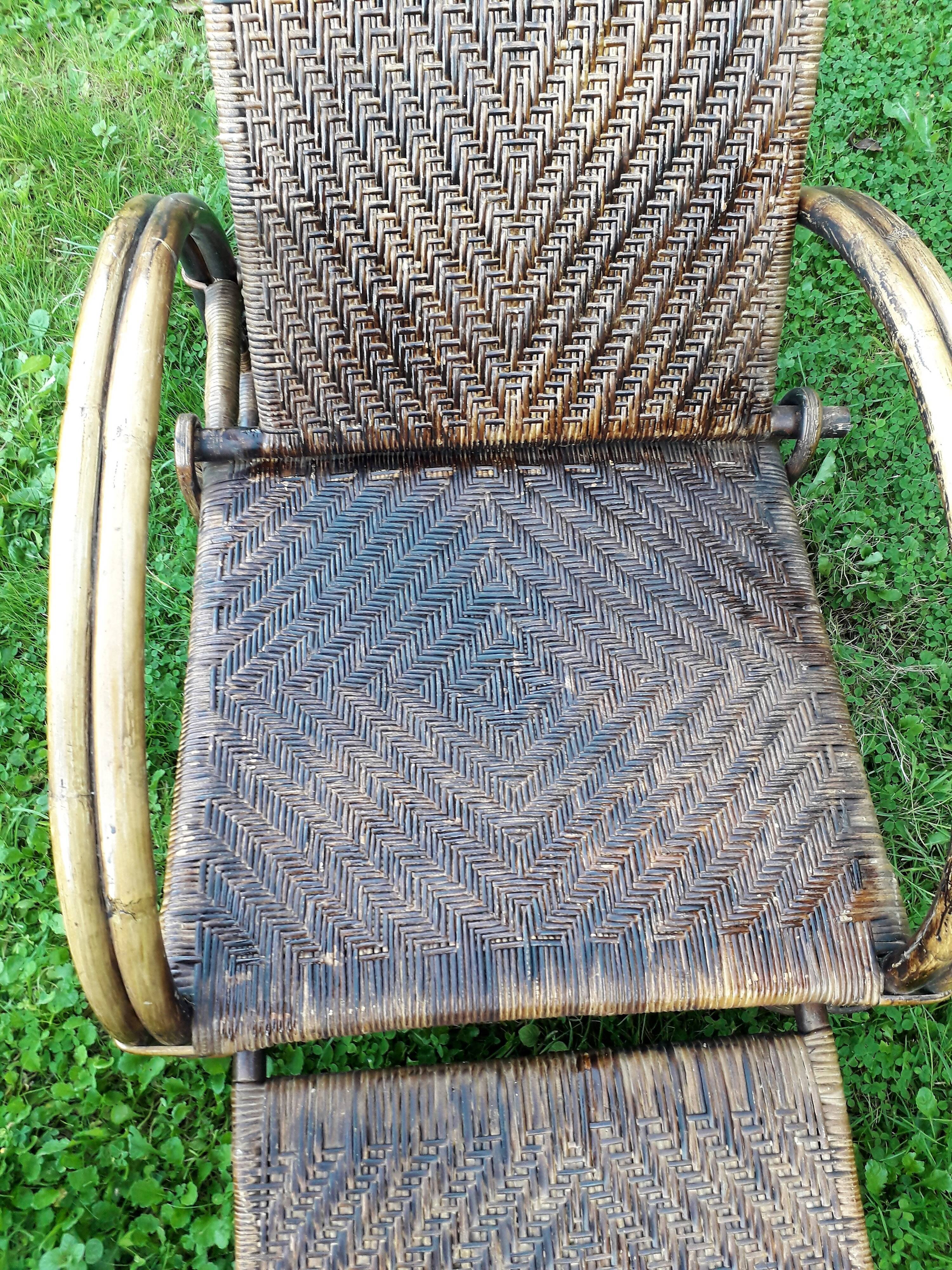 Armchair in rattan with rest foot 60s