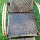 Armchair in rattan with rest foot 60s