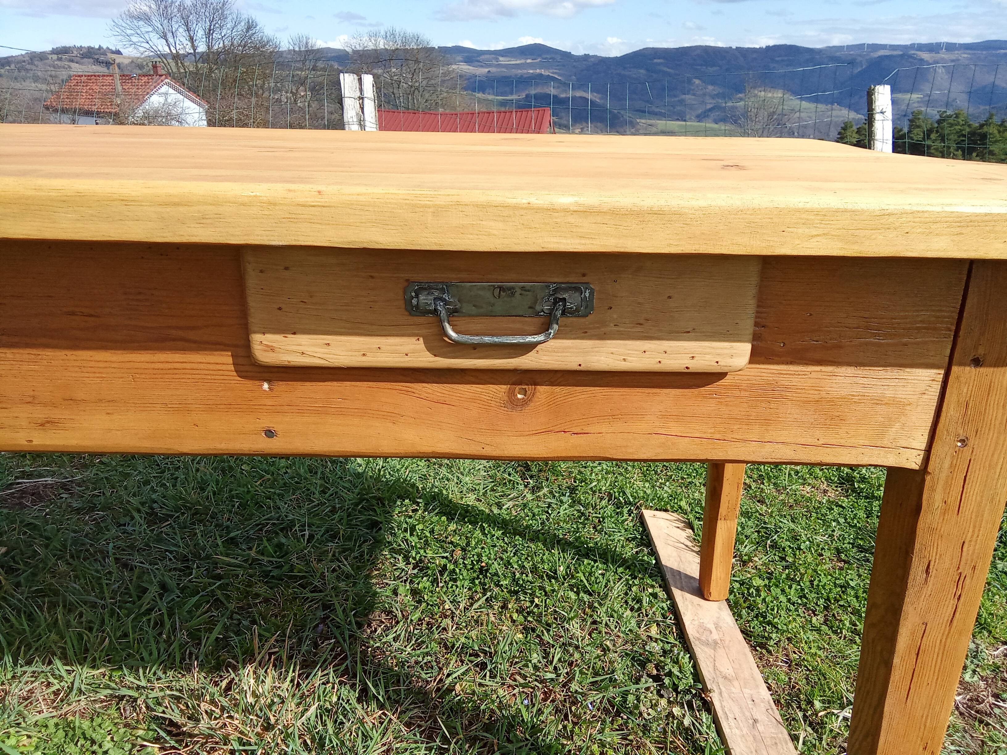 Old rustic farmhouse table made of solid wood.