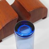 Danish wall mirror by Jacob Hermann & Per Lütken and Holmegaard glass vase, 1960s.