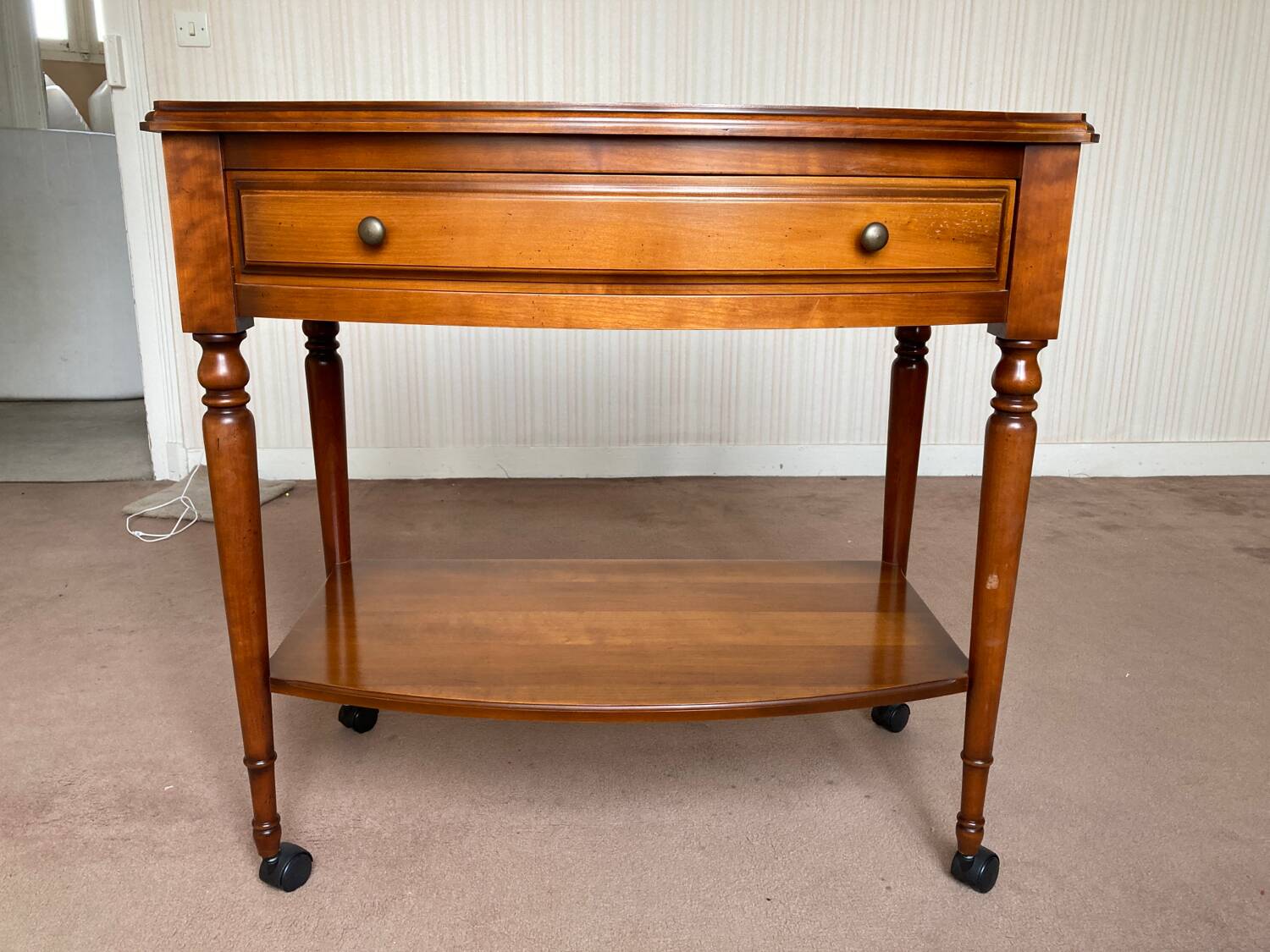 Wooden TV cabinet on casters