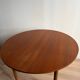 Vintage Scandinavian round table from the 50s and 60s in extendable teak with ra.