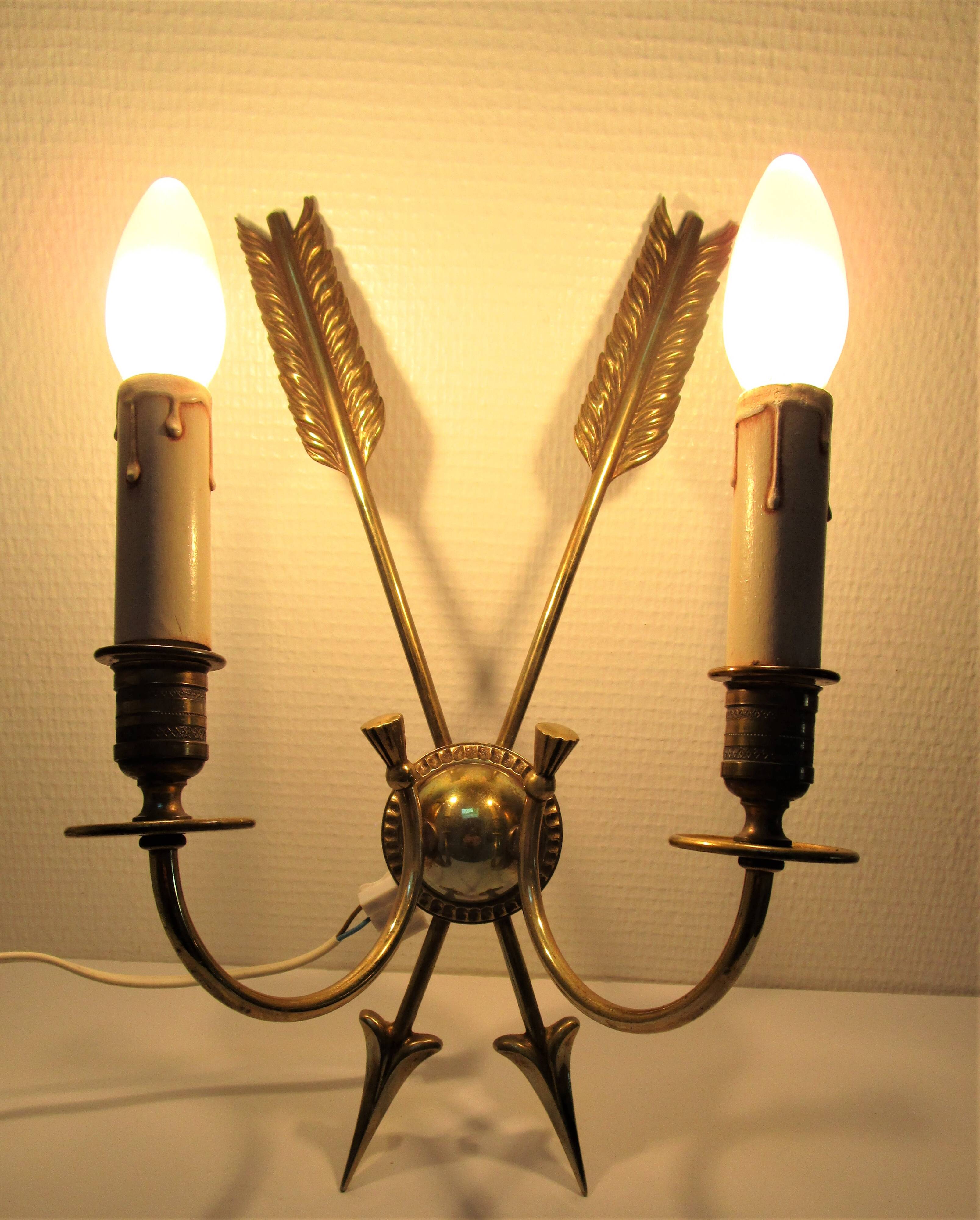 Pair of bronze crossed arrow wall lights Lucien Gau