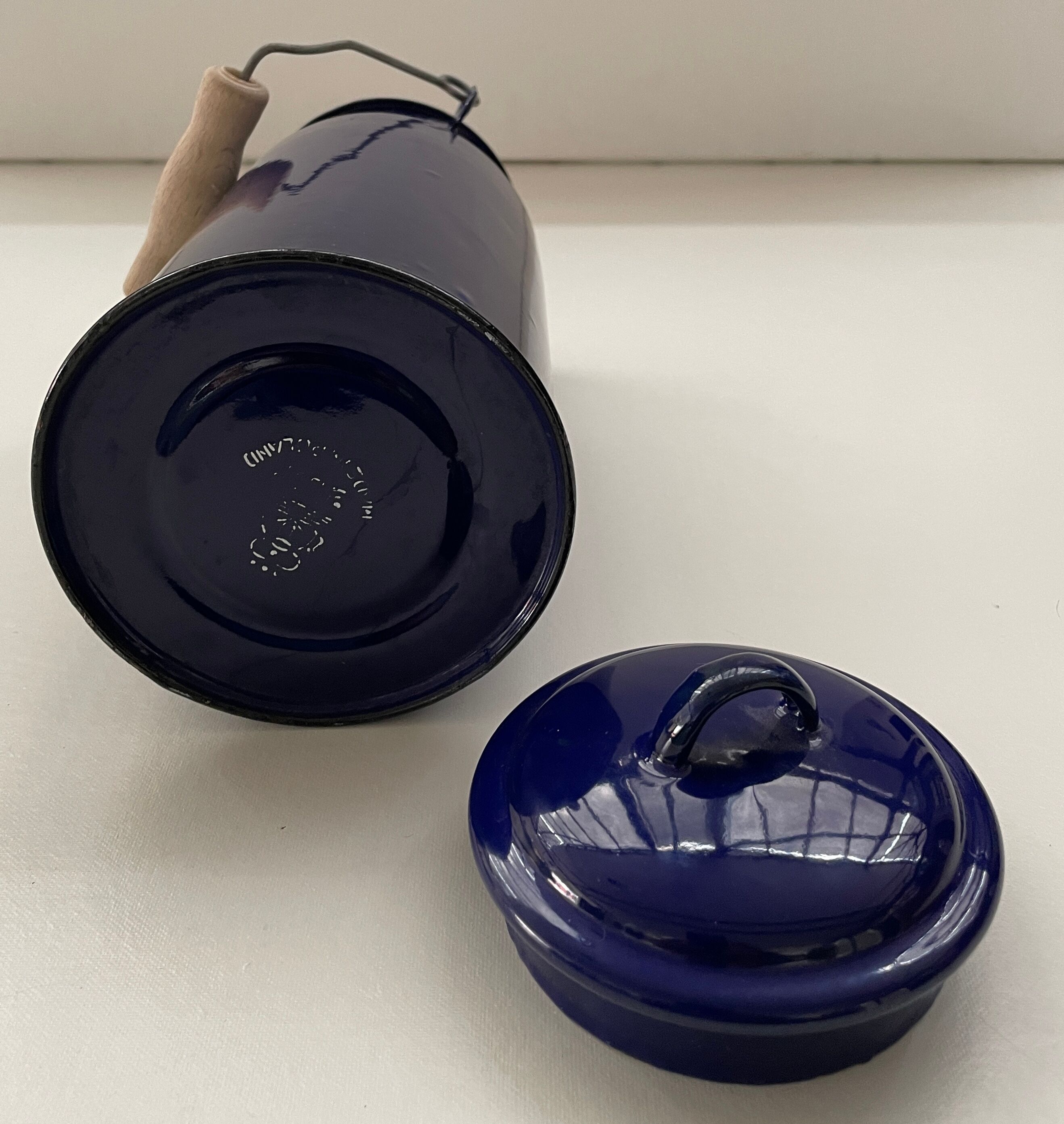 Blue enamelled milk jug