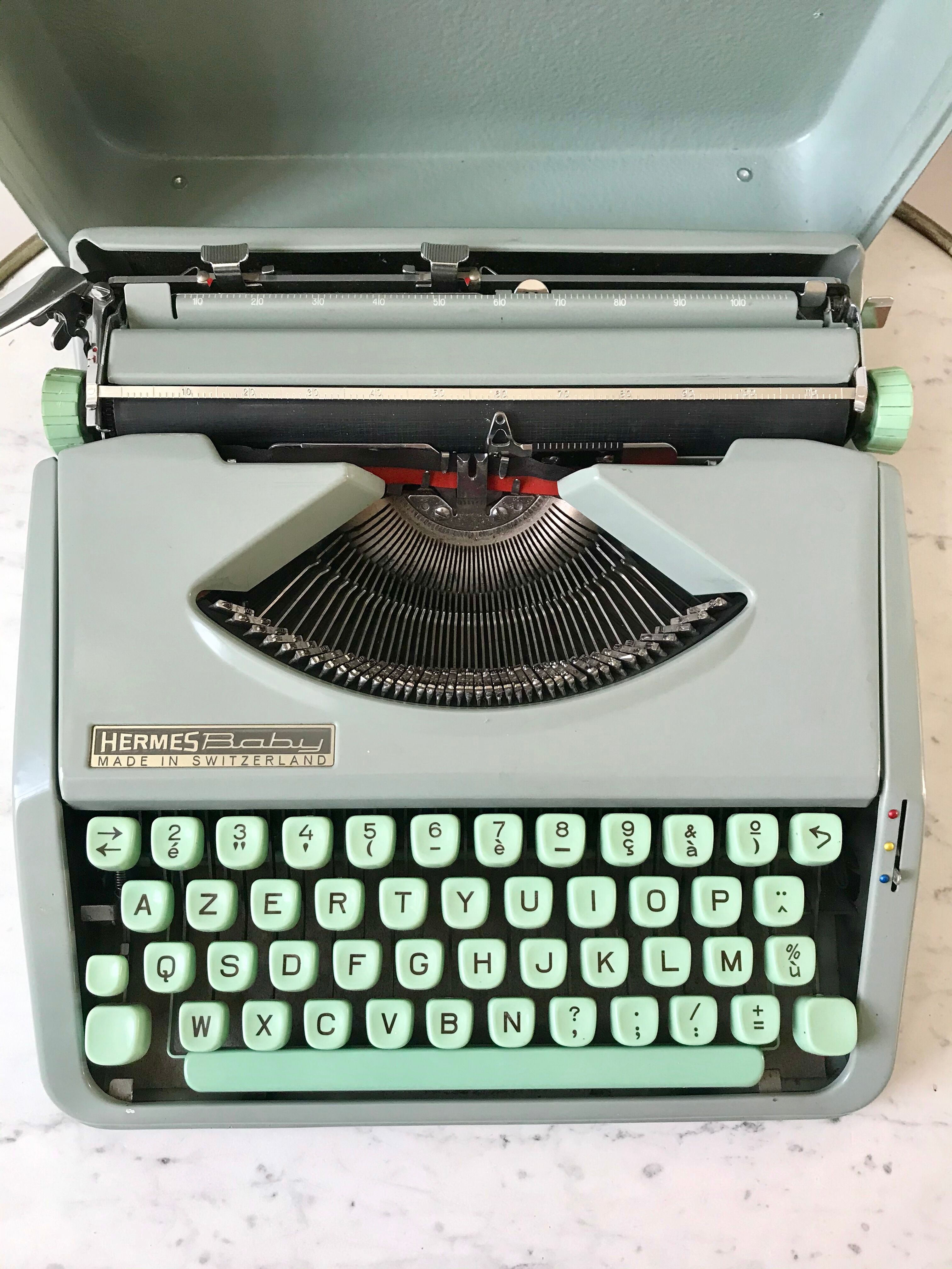 Mint green typewriter hermes baby made in switzerland