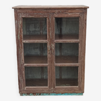Old glazed wooden cabinet with metal bottom