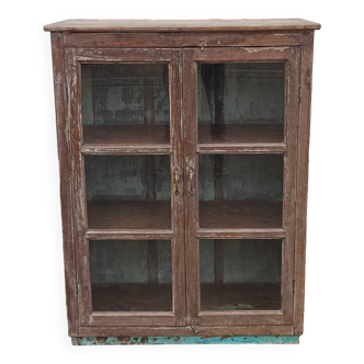 Old glazed wooden cabinet with metal bottom