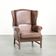 Comfortable cowhide wingback armchair in English style with a timeless look