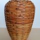 Rattan vase on ceramic