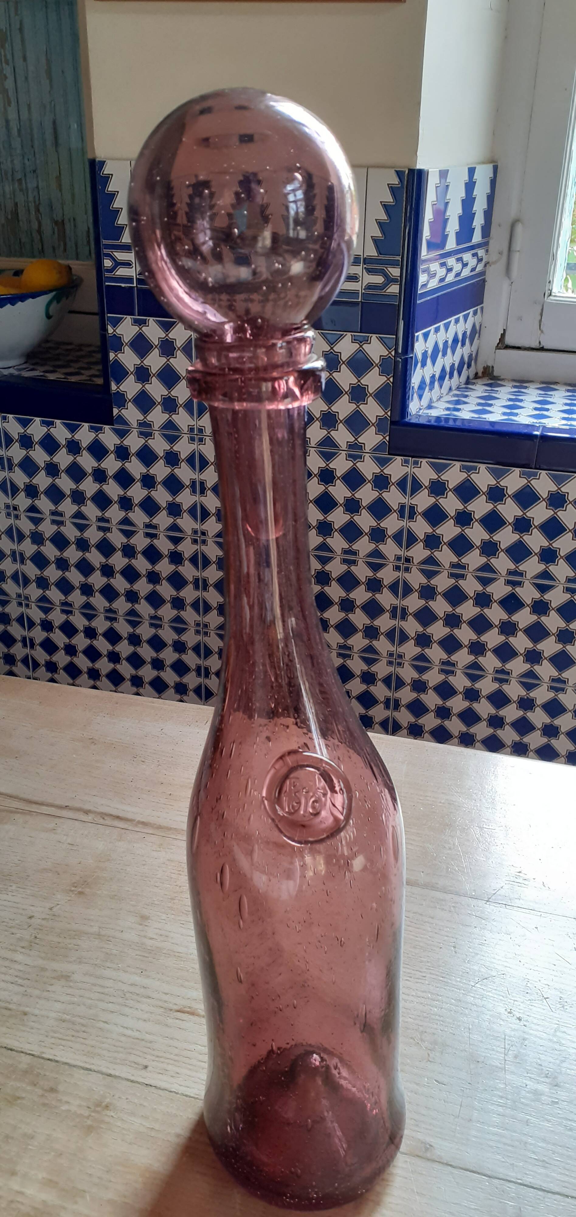 Old long Biot glass bottle