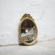 Old oval mirror Louis XVI style in gilded wood 50cm x 34cm