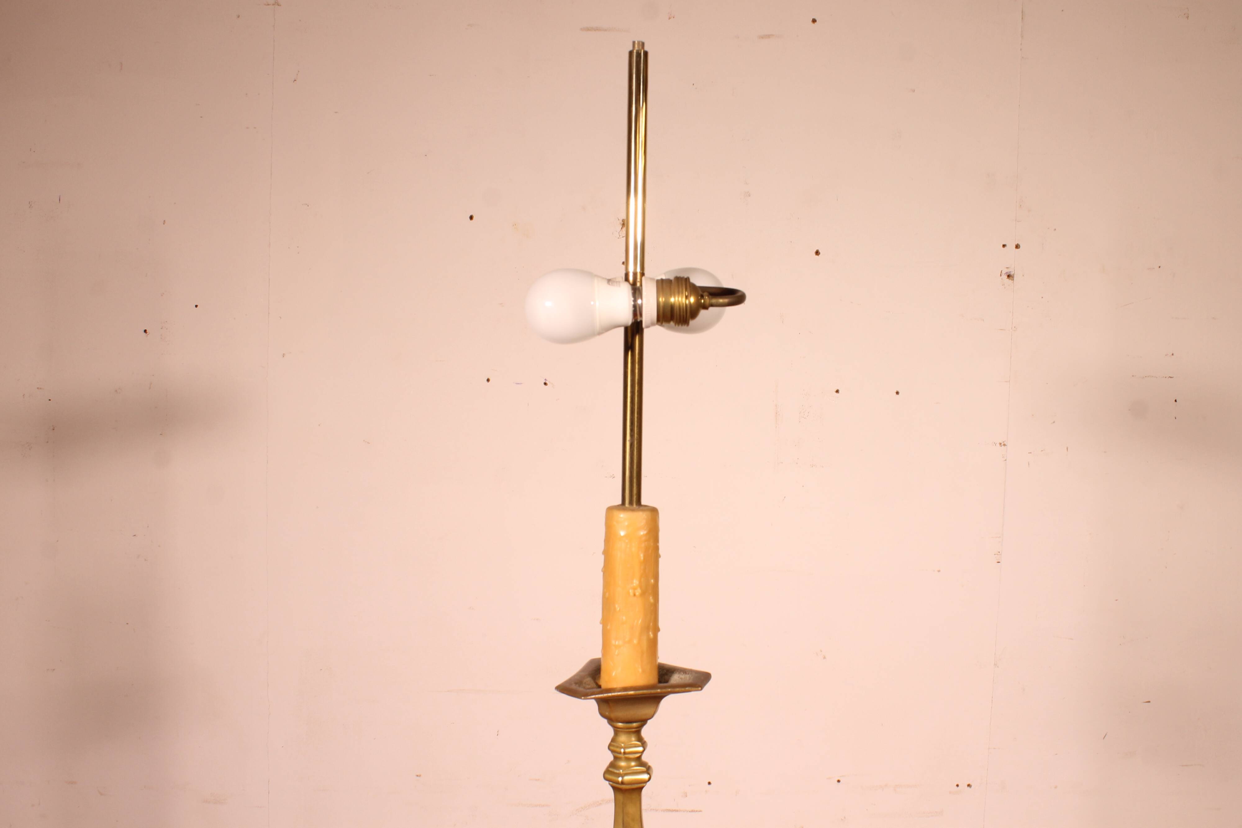 bronze candlestick from the 18th century converted into a lamp with its shade