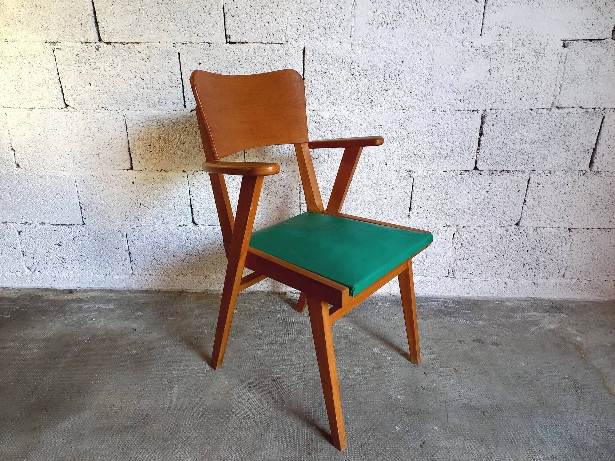 Vintage armchair in skai and wood 60s