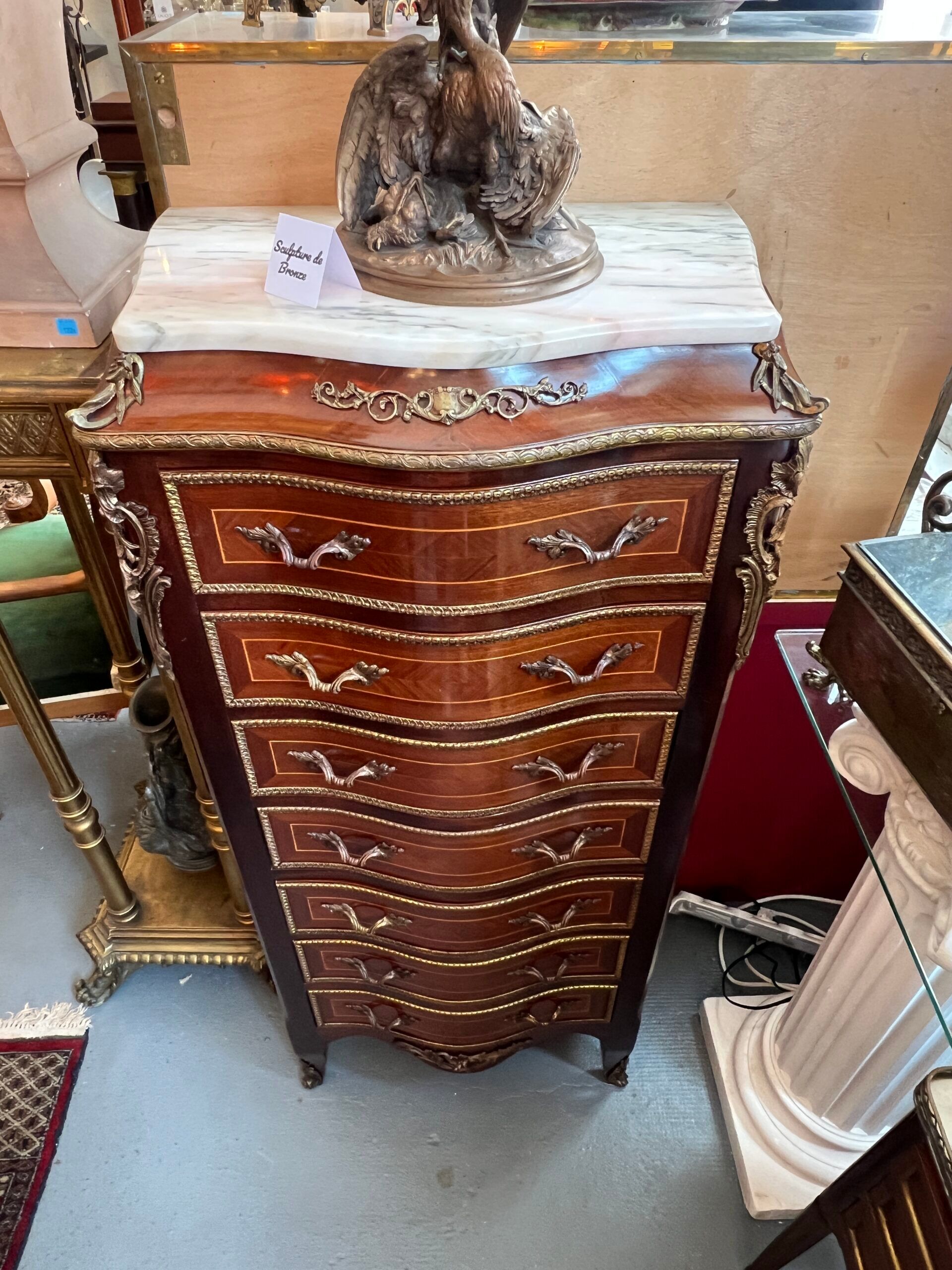 Weekly chest in wood veneer, curved and eventful shape, 20th century period
