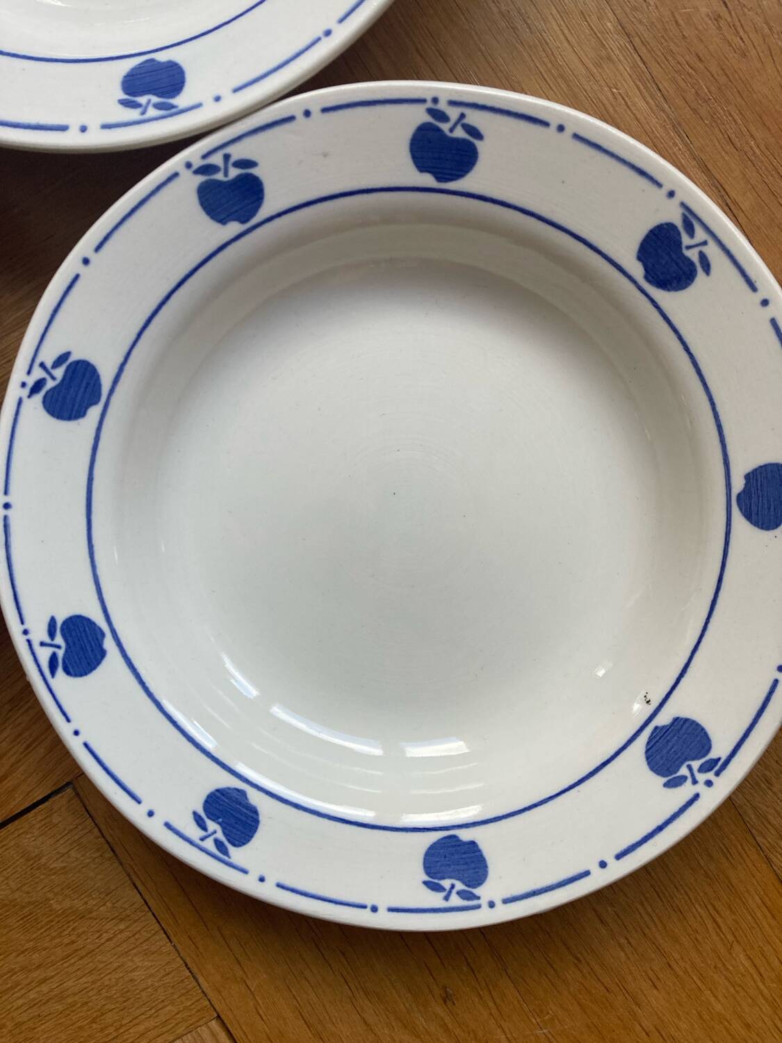 Deep plates with blue apple pattern
