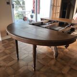 Old oak table with extendable oval central foot