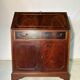 Antique mahogany secretary, upholstered flap and interior storage