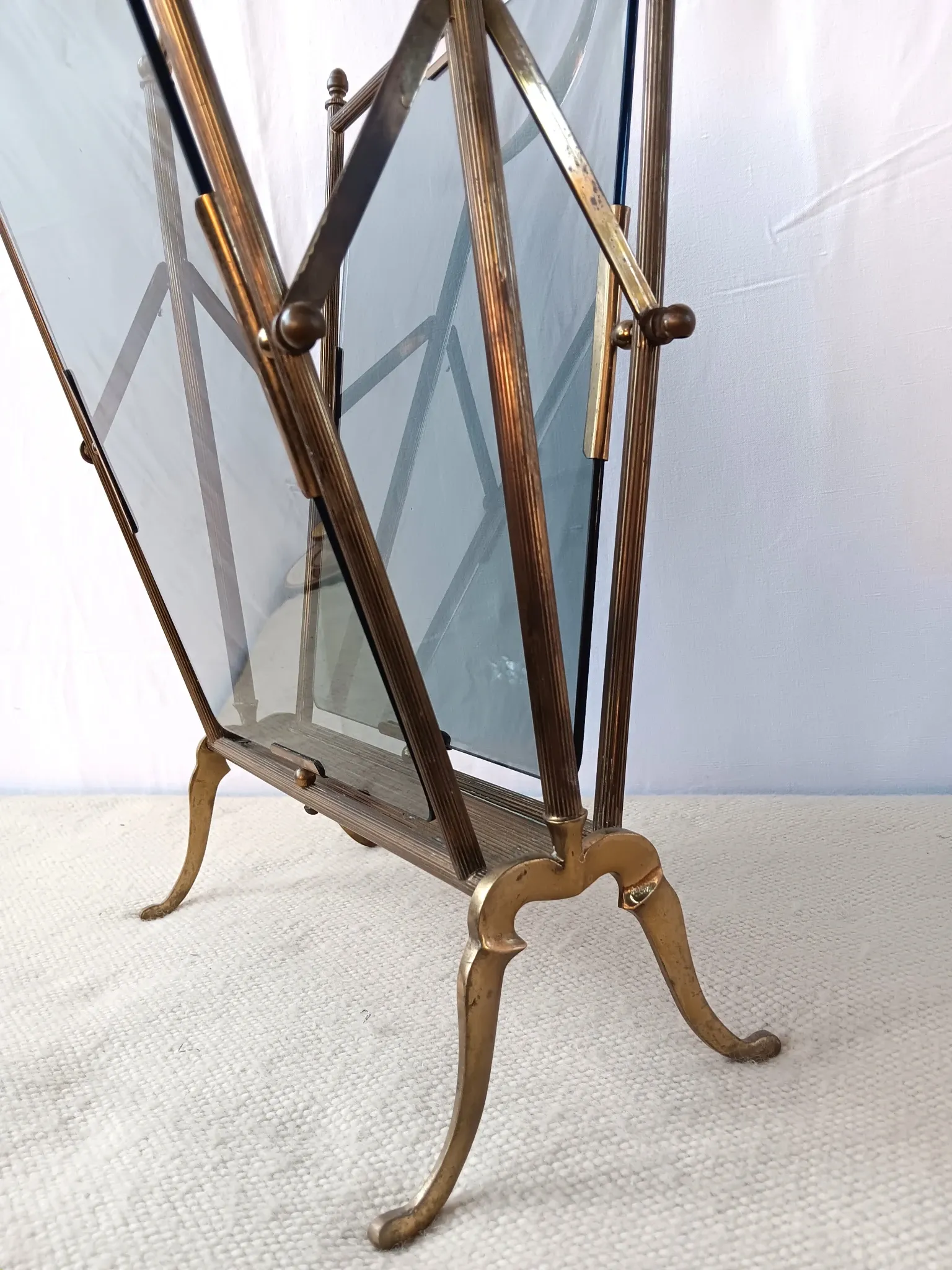 Neo-classical brass magazine rack in the spirit of Maison Jansen.