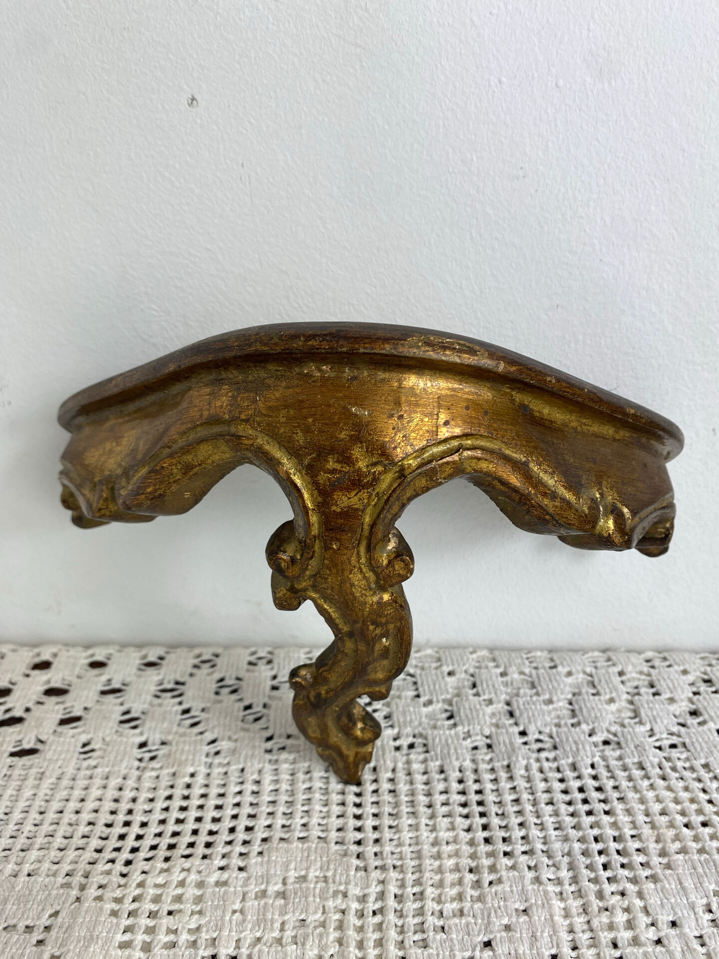 Small baroque-style console in gilded wood.
