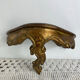Small baroque-style console in gilded wood.