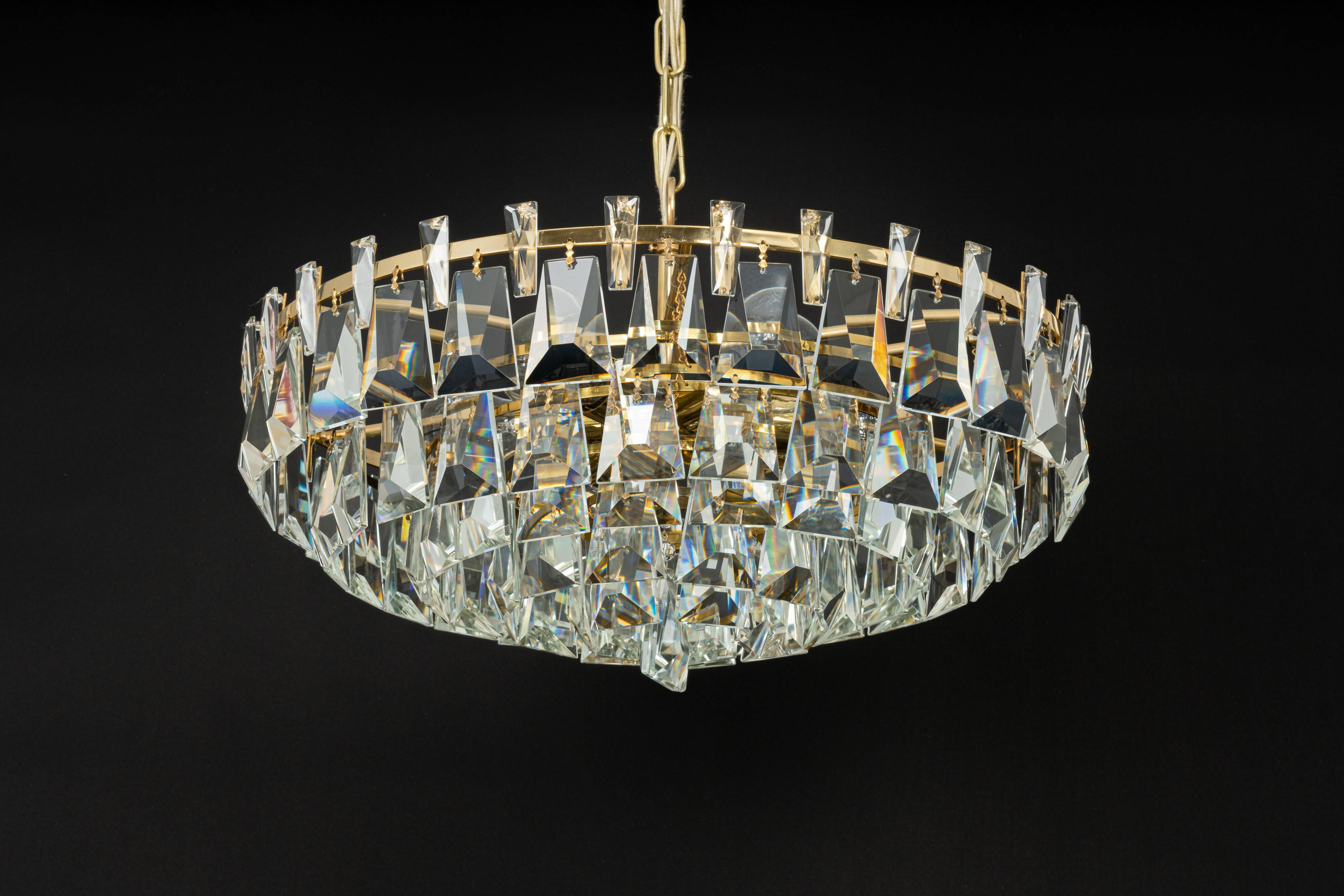 Large chandelier in gilded brass and crystal, by Palwa, Germany, 1970s.