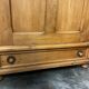Large country pine bonnetière with carved details.