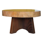 Brutalist wooden coffee table, cruciform leg with a tree trunk top.