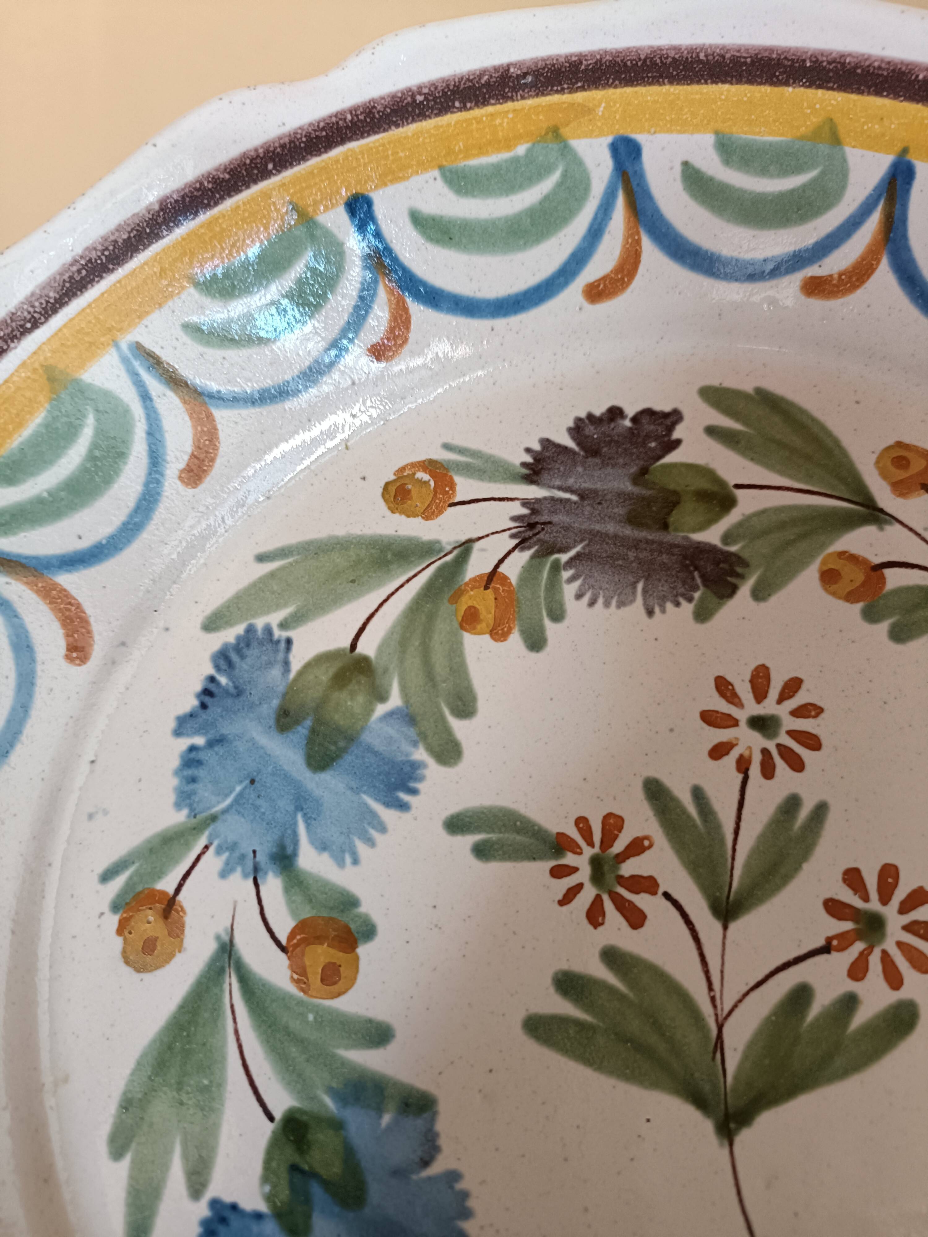 Antique hollow plate from Nevers pottery.
