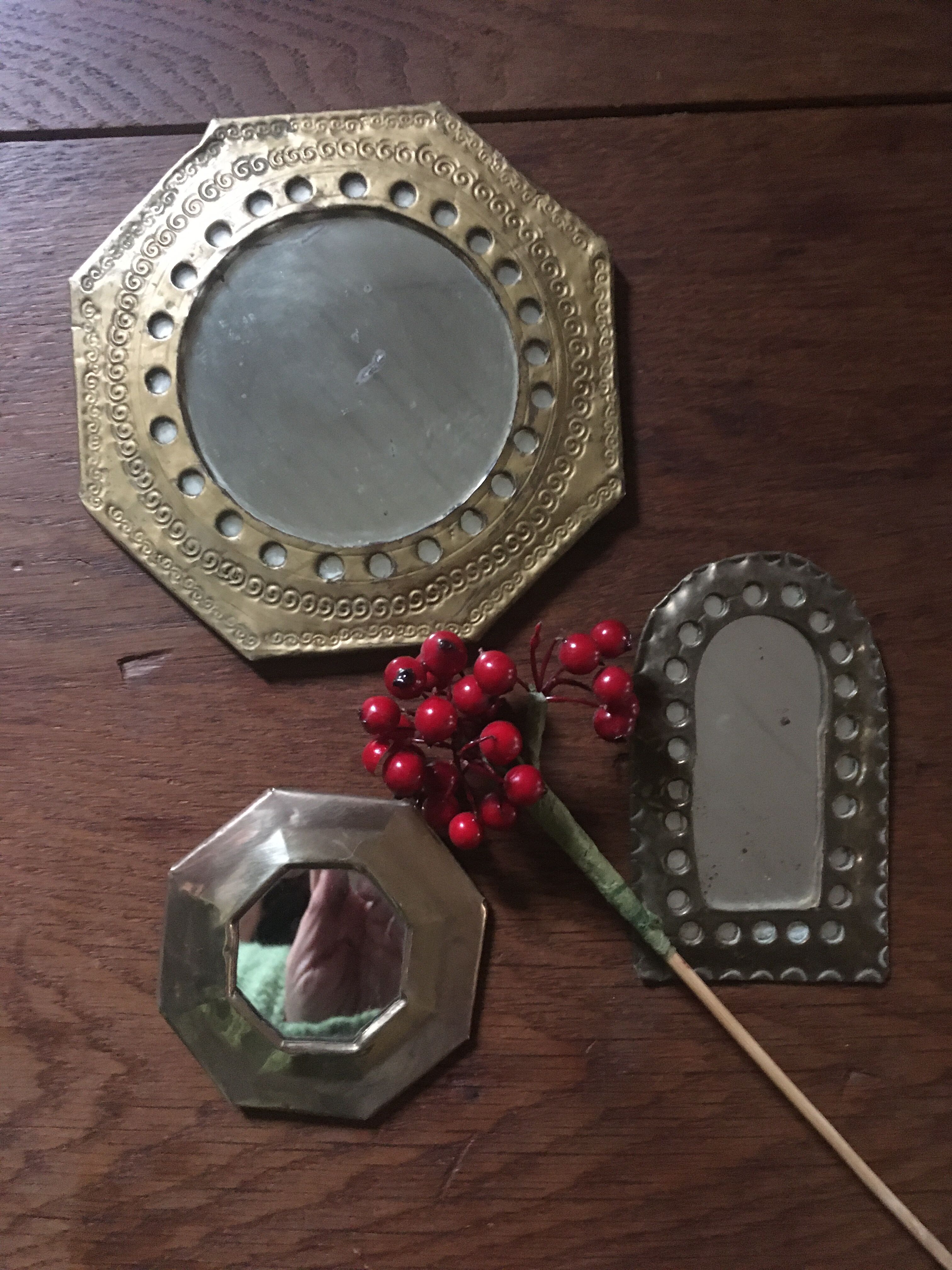Ethnic brass mirrors.