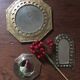 Ethnic brass mirrors.