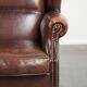 Vintage sheepskin wingback armchair with a timeless English look