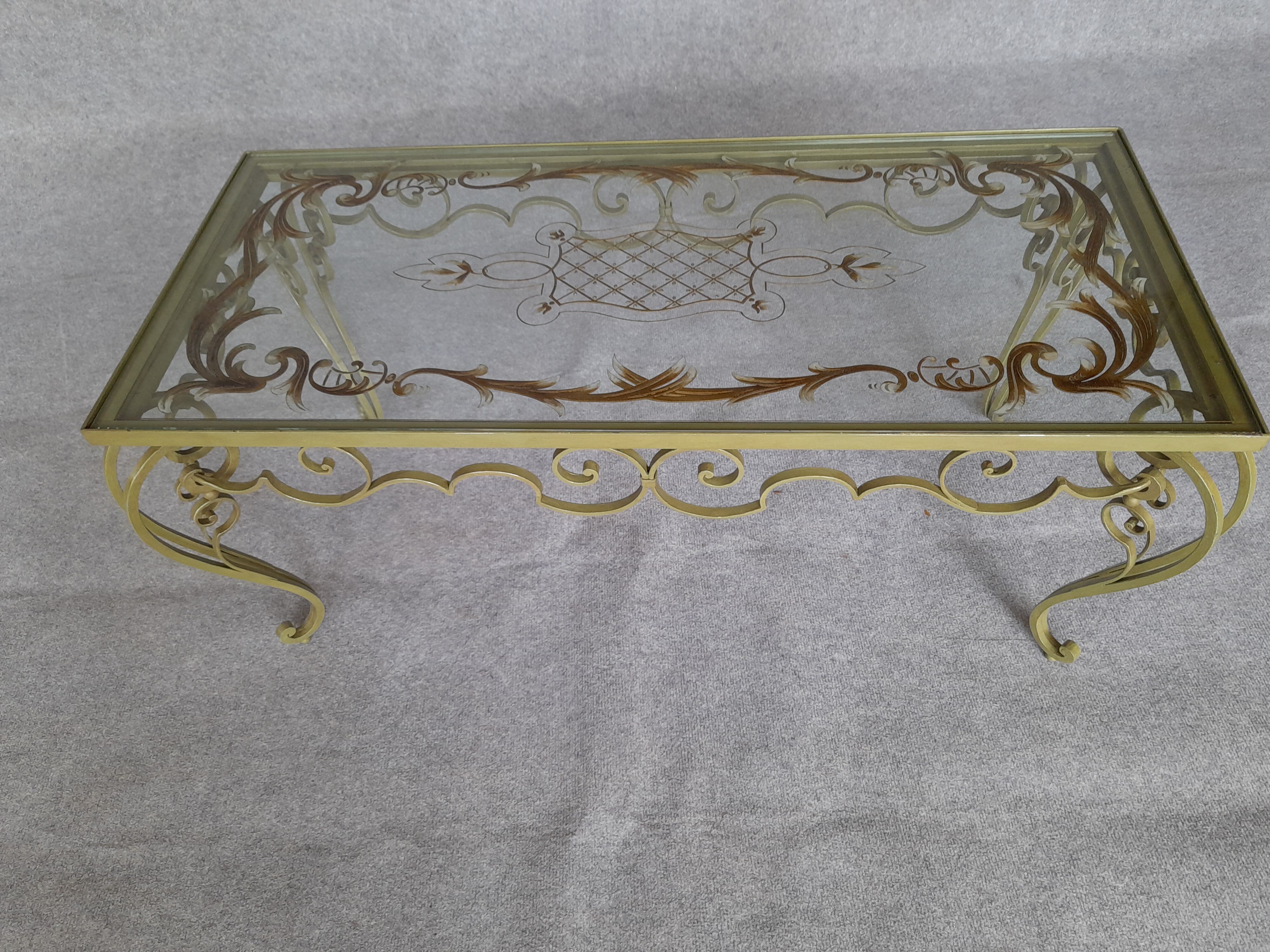 Glass and wrought iron coffee table. 1950s/1960s