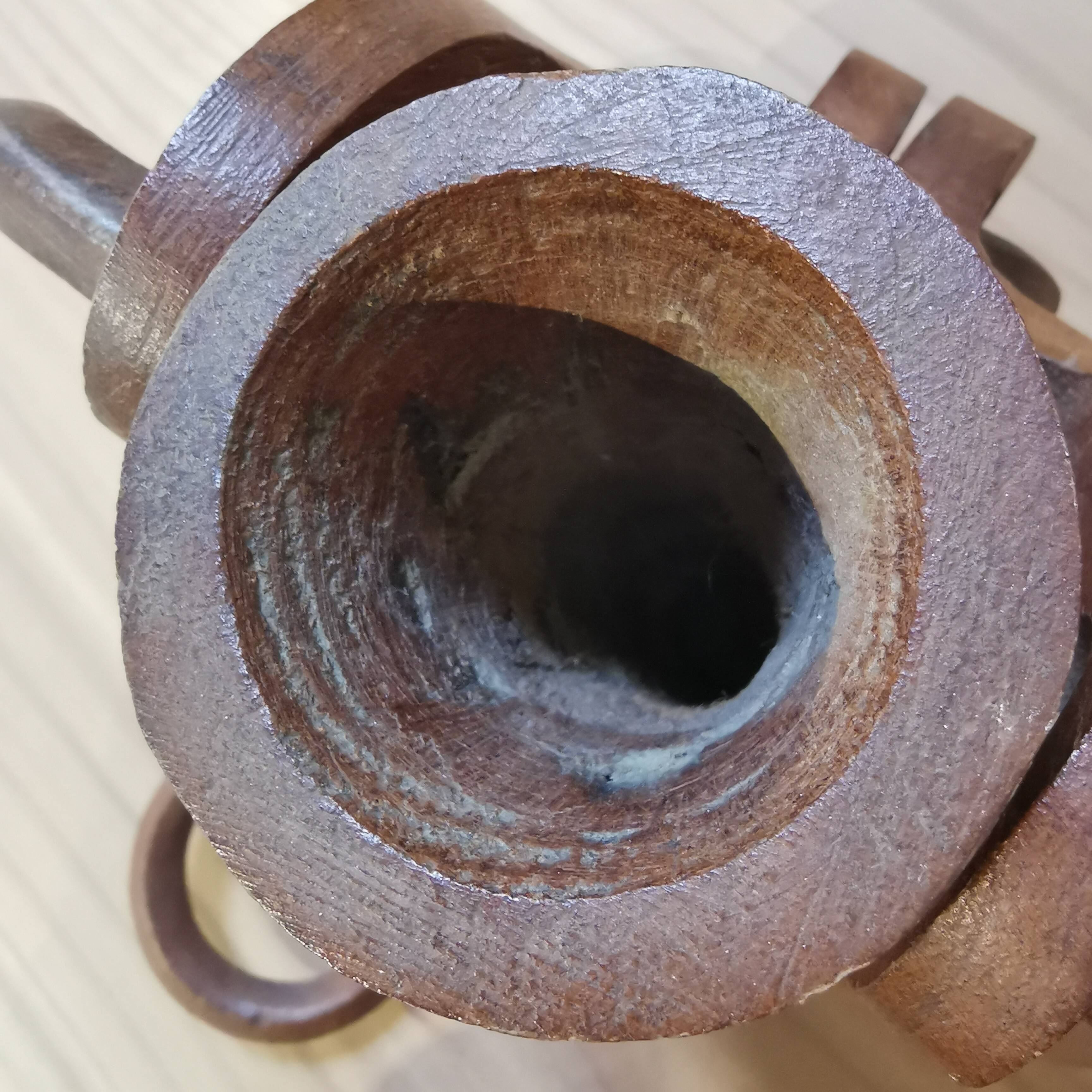 Vase with carved wooden handles