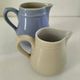 Duo of pastel ceramic milk jugs – Lavender blue & vintage cream