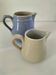 Duo of pastel ceramic milk jugs – Lavender blue & vintage cream